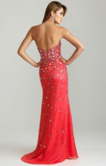 Style 6745: This strapless sweetheart Night Moves style is perfect for prom 2015, pageants, and quinceañeras. Heavily beaded over the bodice with rhinestones and mirrored triangle pieces, the beading lessens as it streams down the dress. A slit over the left leg adds some flair to this watermelon-colored style. Due to all of the beading over this dress, this style photographs amazingly as all of the beads capture and reflect the light.